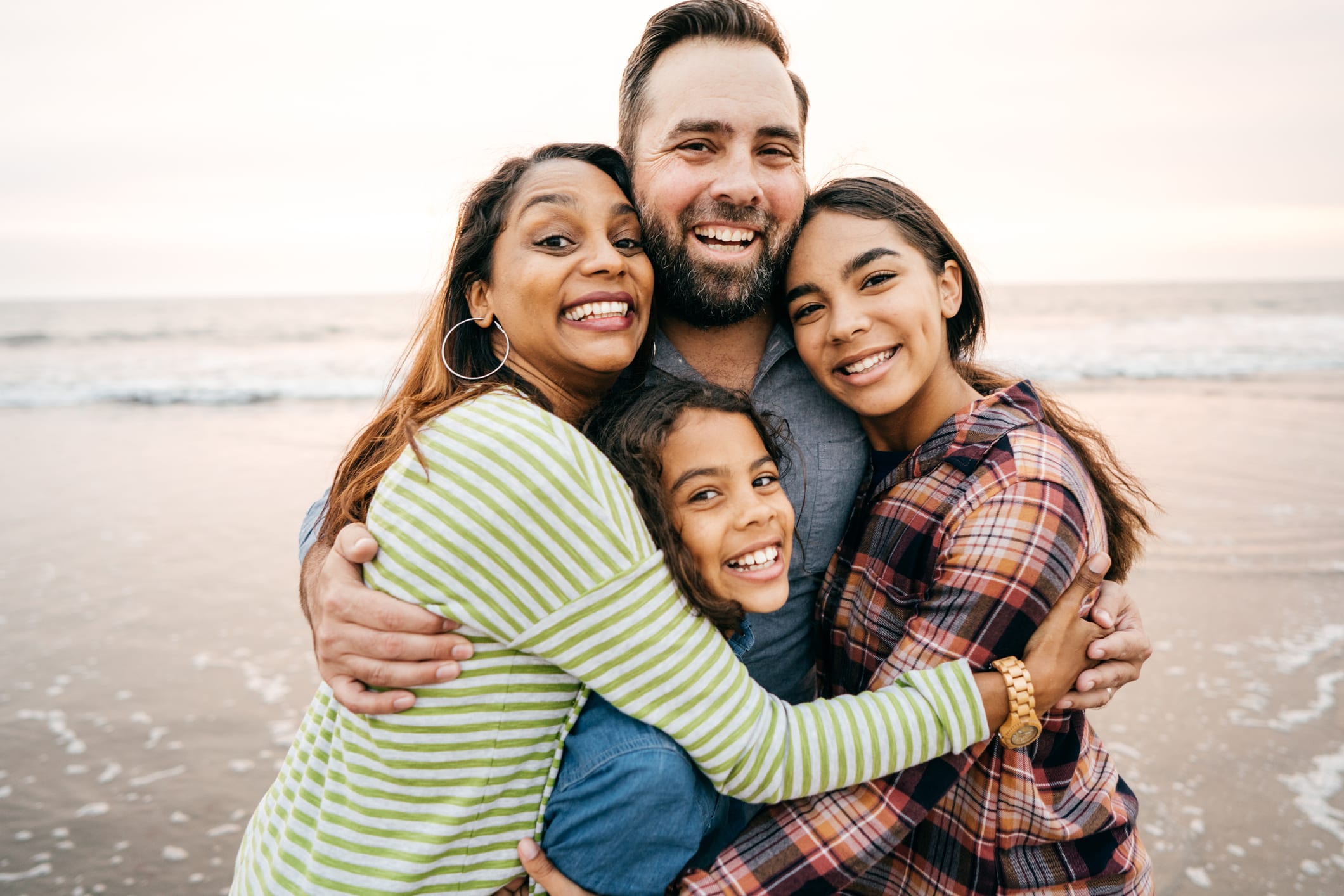 Happy family enjoying time together at the beach